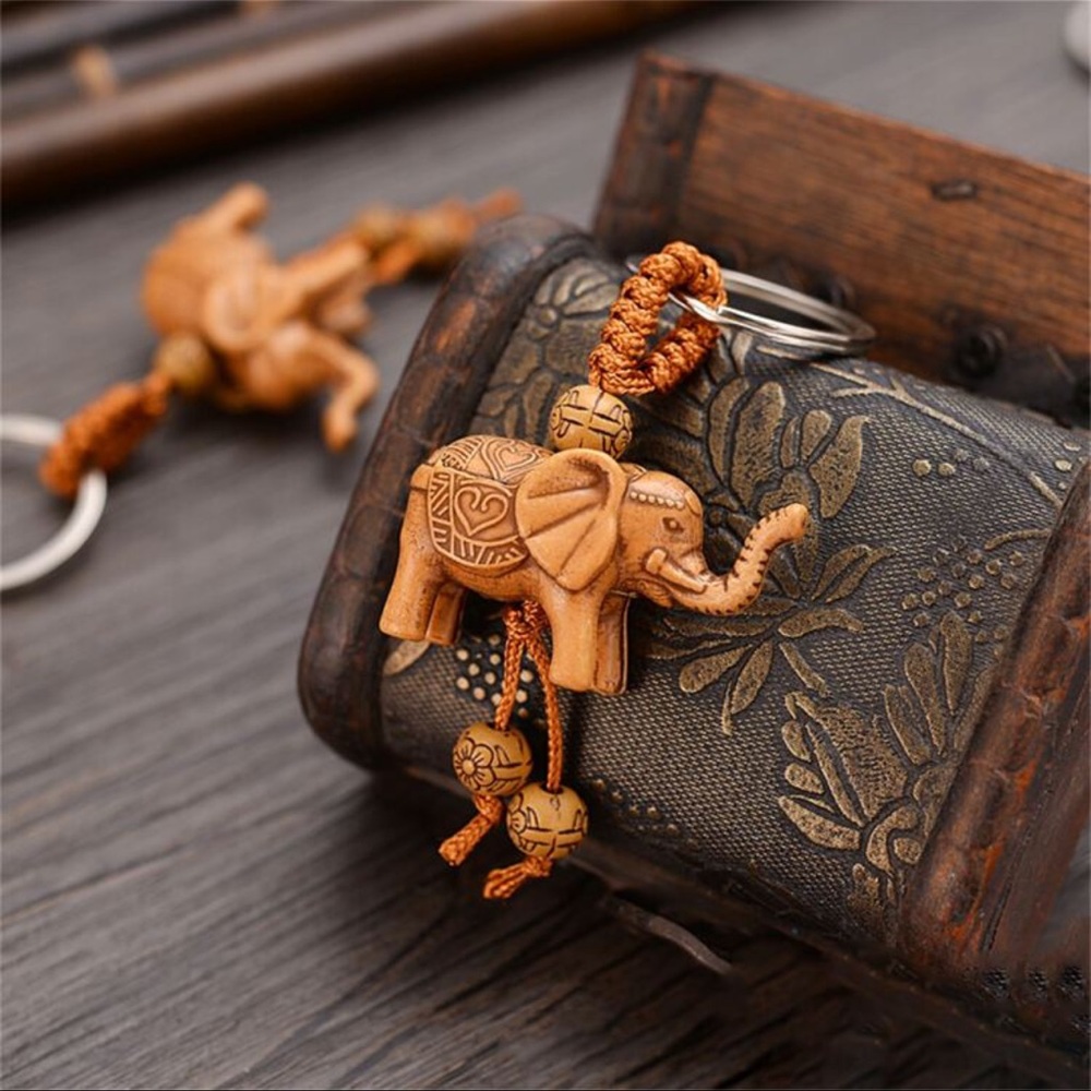 Carved elephant wood grain key chain. New.